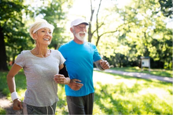 Elderly couple on a day-time walk.